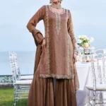 Elegant rose gold gharara suit in shimmer tissue fabric featuring a heavily embroidered neckline and border, paired with a matching sheer dupatta.