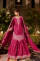 Magenta Pink Embroidered Crepe Gharara Set: A woman in a vibrant pink festive outfit featuring silver Zari handwork, flared gharara pants, and a matching dupatta.