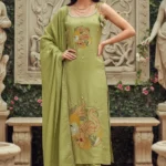 Green Embroidered Straight Kurta Set: A woman in a minimalist cotton ensemble with delicate threadwork, ideal for summer work wear and casual outings.