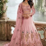 Designer Pink Lehenga in Luxury Ethnic Wear style with Intricate Zari Embroidery and Sequin Work, perfect for a Sangeet Outfit or Bridesmaid Fashion.