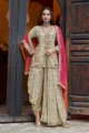Beige Georgette Drape Dhoti Set with heavily embroidered tunic and a vibrant pink scalloped dupatta.