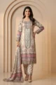 Model in a premium white printed A-line kurta set with matching straight pants and dupatta featuring intricate pastel floral patterns