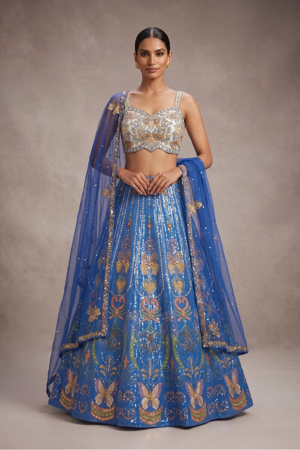 royal-blue-sequin-lehenga-set Designer blue lehenga choli for luxury wedding guests featuring intricate gold mirror work and a sheer dupatta