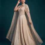Ivory Chinon Lehenga with an intricately embroidered net cape and corset blouse