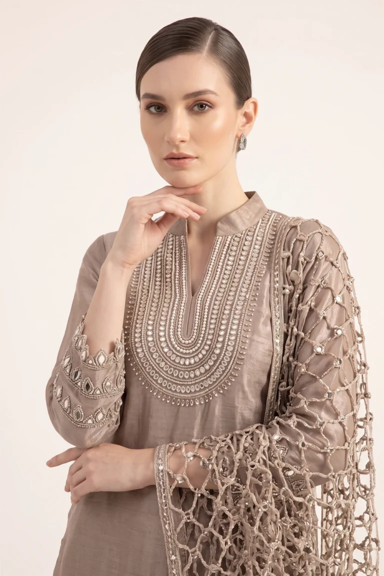Close-up view of the dense handcrafted beadwork and zardozi embroidery on the V-neck bib of the Mocha Brown tissue silk kurta.