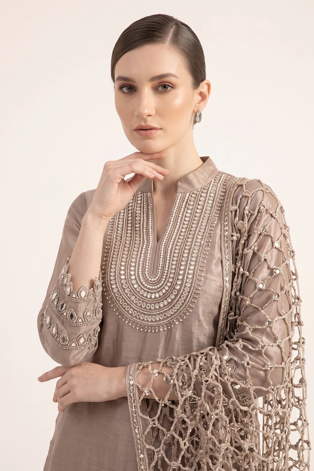 Close-up view of the dense handcrafted beadwork and zardozi embroidery on the V-neck bib of the Mocha Brown tissue silk kurta.